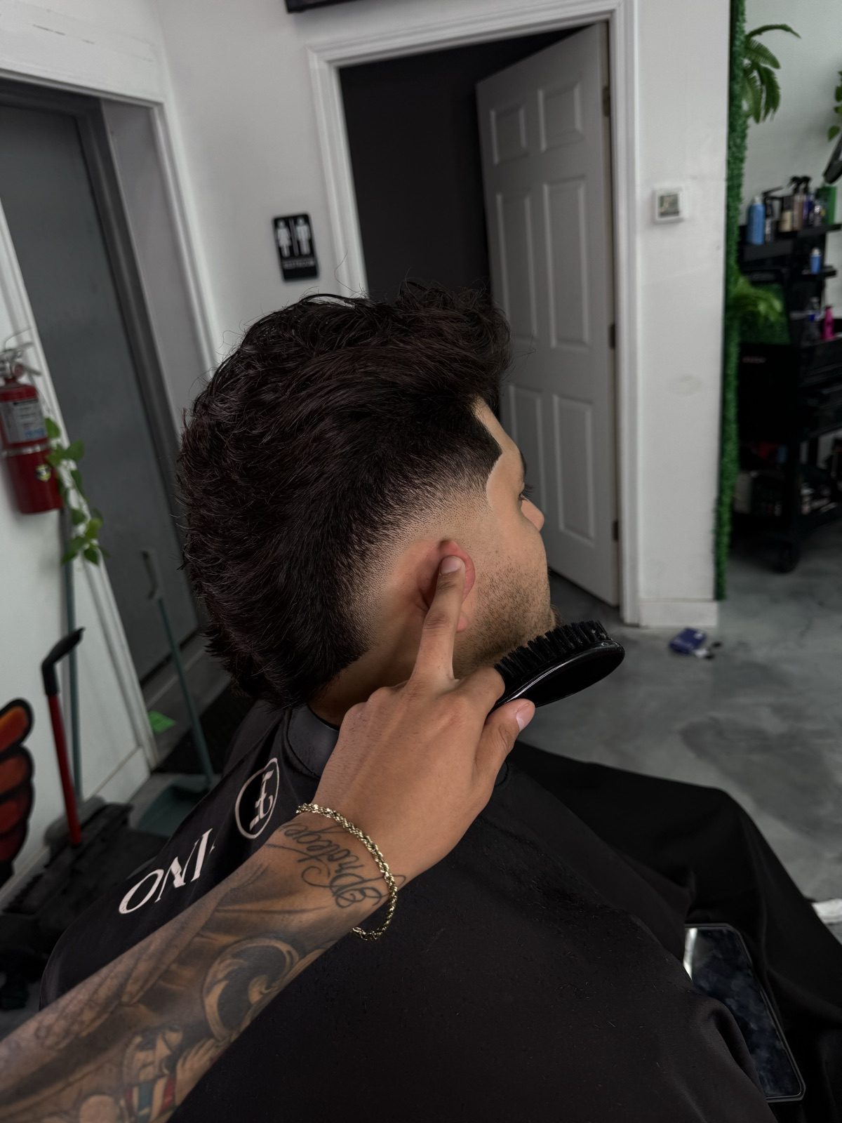 Taper fade with natural texture left on top